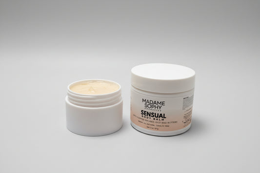 Two jars of Madame Sophy Sensual Body Lotion on a textured surface with a neutral background.